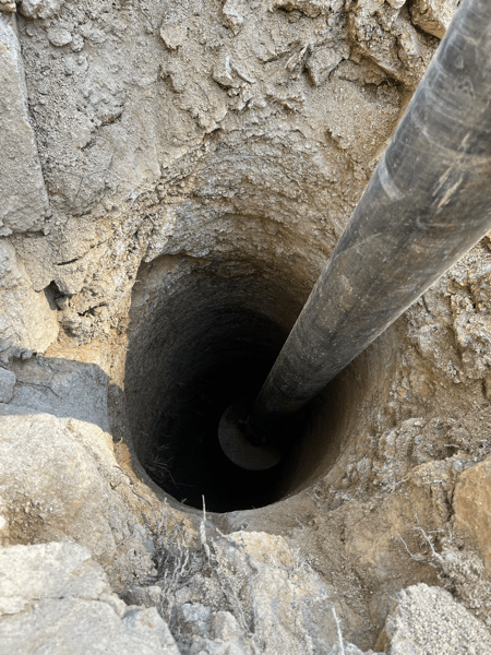 pier hole with drilling bit still in it
