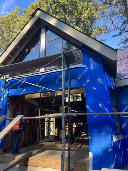 ADU front, with the exterior covered in blue plastic underlayment