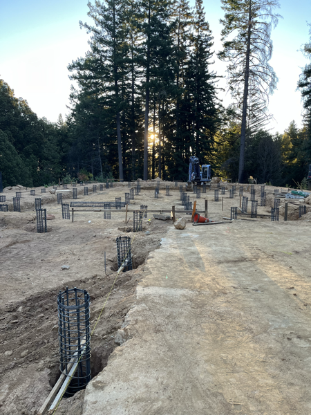 Building site dotted with rebar cages for foundation piers